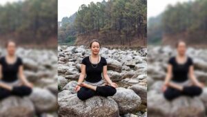 Woman sitting in lotus by the river